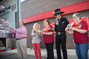 Richard Petty joined representatives from Smithfield, Meijer and the Food Bank of South Central Michigan to unload a portion.jpg