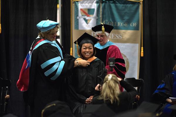 A ceremony recognizing the next generation of professionals who completed their masters and doctoral degree studies at Husson University will take place at the Newman Gymnasium in Bangor at 7:00 p.m. on May 4, 2018. Twelve-hundred people are expected to attend a ceremony recognizing 287 students, the largest group to ever participate in a Husson hooding ceremony. Seventy-nine doctoral and 208 master’s degree candidates will cross the stage to receive their hoods.  

During a hooding ceremony faculty and students are dressed in academic regalia. Faculty members place the hood over the head of the graduate to signify his or her success in completing their degree. 
