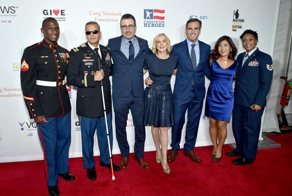 Kionte Storey, Ivan Castro, John Oliver, Lee Woodruff, Bob Woodruff, Jen Oh and Deondra Parks on the red carpet at the 11th Annual Stand Up for Heroes, a benefit for wounded veterans and their families through the Bob Woodruff Foundation. Photo by Bryan Bedder/Getty Images for Bob Woodruff Foundation.