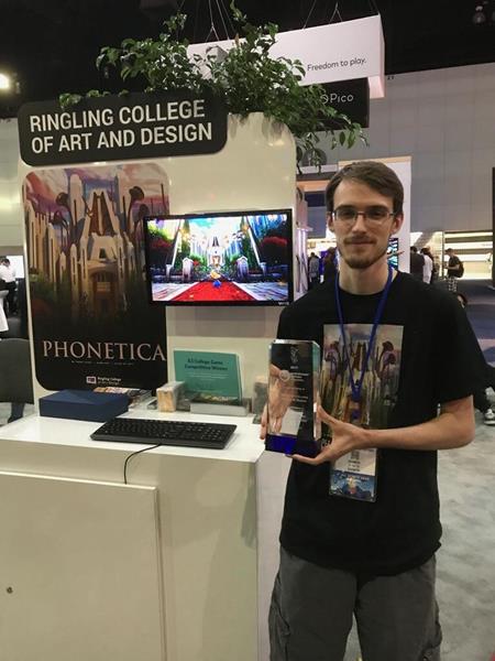 Trent Sivek (Game Art, '17) with his award at E3.