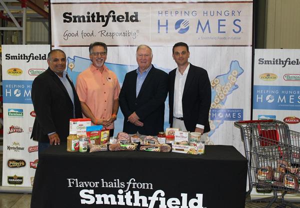 Jonathan Huhn joined representatives from HEB, San Antonio Food Bank and Smithfield.JPG