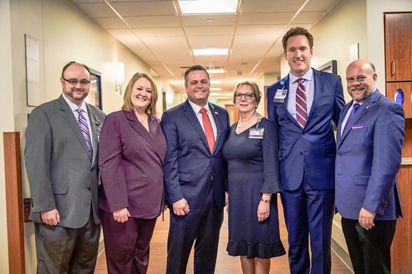 Methodist Dallas Medical Center's President, John Phillips (second from right) with VITAS management team (from left) Sr. VP of Operations Craig Tidwell, general manager Marilyn Conley, CEO Nick Westfall, VP of Operations Kathy Prechtel, and COO Joel Wherley.