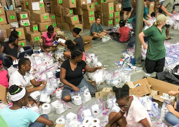 Mission of Hope staff and kids from the MOH orphanage and Transition Home packing over 1,500 family sized hygiene-kits that were sent to the Turks and Caicos Islands.