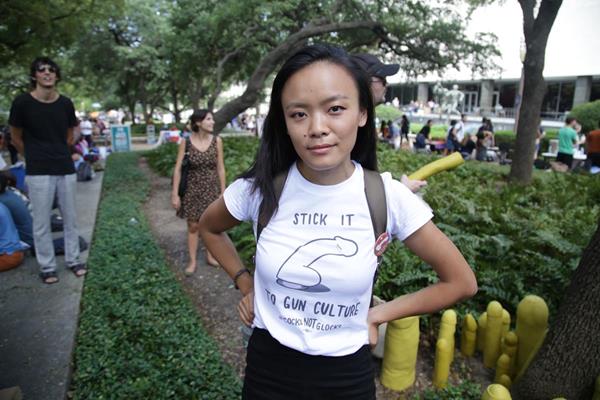 Cocks Not Glocks Creator Jessica Jin at the UT Austin Anti-Campus Carry Rally in 2016." 
Photo credit Marshall Tidrick.
