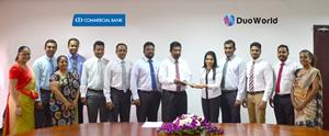 Commercial Bank Assistant General Manager – IT Krishan Gamage exchanging agreements with Duo World Inc. CFO/ Director Jennifer Samuel Perera