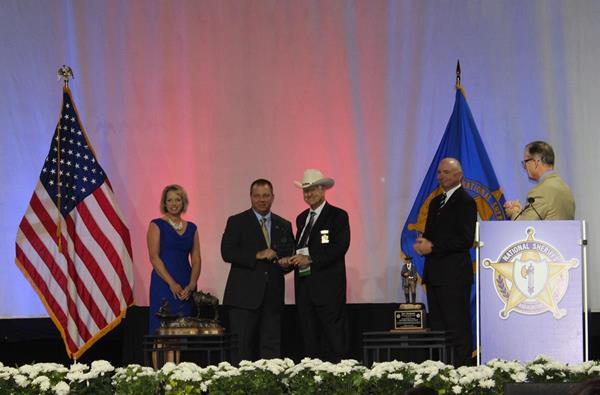 Sheriff Brian Wallace accepts the 2018 Crime Victim Services Award. 

Pictured (from left to right): Sheriff Kathy Witt, Chair of the NSA Domestic Violence & Crime Victim Services Committee; Sheriff Brian Wallace, Marion County Sheriff’s Office; Sheriff Harold Eavenson, NSA President; Mr. Josh Bruner, Appriss Safety President; Mr. Jonathan Thompson, NSA Executive Director/CEO