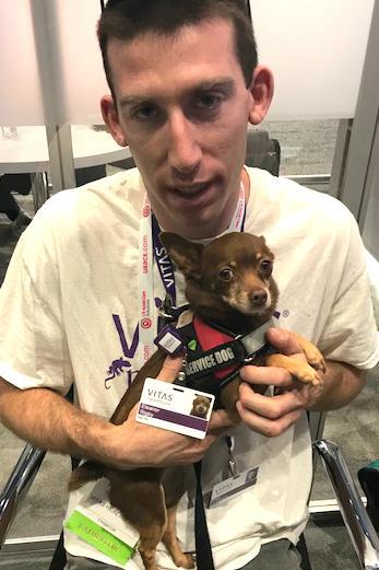 Paw Pals, like Eleanor Rigby and volunteer Michael Robertson pictured here, are at the VITAS Healthcare Booth #1847 throughout the ACEP scientific assembly.