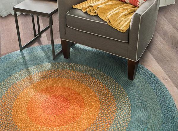 The Tapestri area rug line includes braided round styles, shown here in Stellar*. A warm aurora of concentric color brings good vibes and luminosity to every space. This glowing red, orange, and blue ombre rug is made of soft jute yarn and pairs beautifully with a whole range of décor styles -- bringing just the right amount of drama. Hand-braided by skilled artisans using ancient techniques, each piece supports fair labor practices and sustainable design. 

*This rug's namesake is a pleasant, nine-year-old bichon frise who enjoys napping and bossing around the larger dogs. 
 