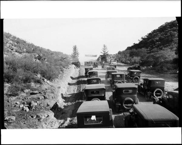 PHOTO 1:  
C.C. Pierce Company, Automobiles clustered at the opening of the Mulholland Highway, 1924, gelatin silver print, California Historical Society Collections at the University of Southern California
