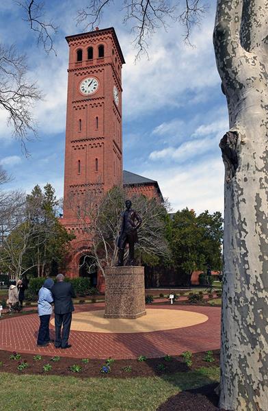 Visitors view statue of Hampton University founder, Brigadier General Samuel Chapman Armstrong