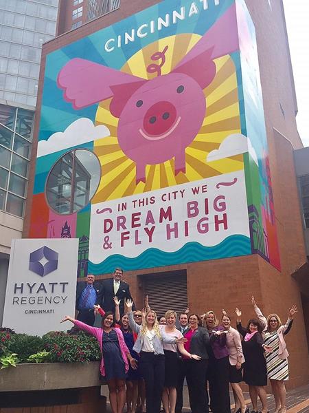 The Hyatt Regency Cincinnati Team welcomes the "Flying Pig" mural 