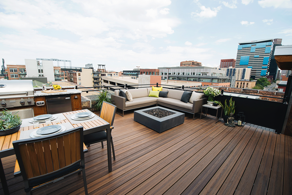 BMD's Southern California branch will distribute TAMKO's composite decking, including the luxury collection, Envision Distinction, shown here on a sleek, modern rooftop deck in Spiced Teak.
