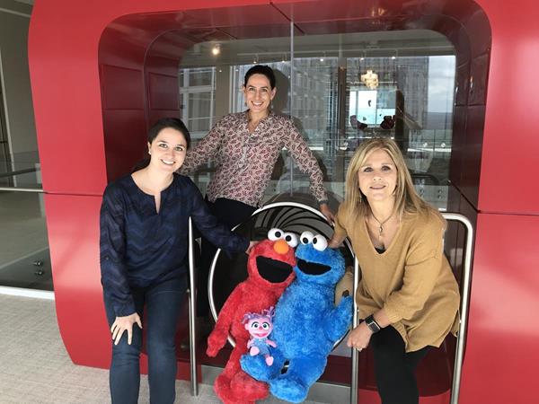 The Kids II Strategic Partnership team with some of the Sesame Street characters who inspired the newest Bright Starts line coming in 2019. LtoR: Jaime Martin, Eriana Rivera-Rozo and Karen Neblett