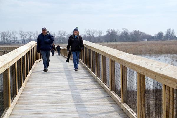 Visitors take in expansive views along the Madewell Trail, a 1,300-foot boardwalk named after former Metroparks Toledo Executive Director Steve Madewell.