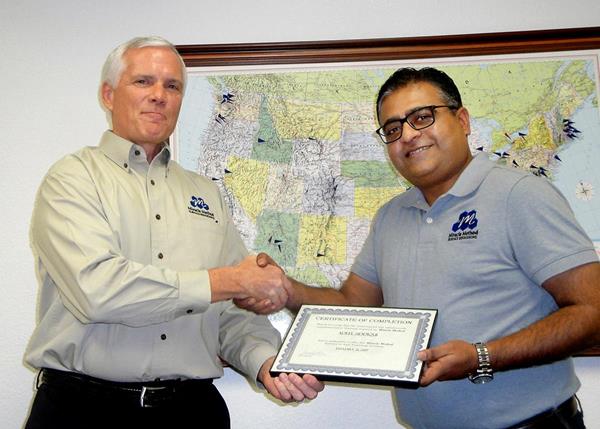 Miracle Method Surface Refinishing President Chuck Pistor (Left) congratulates Houston Southwest Franchise Owner Adeel Siddiqui for finishing franchise training, allowing him the opportunity to take over the successful work of current franchise owners Paul and Jonee Barnett. 