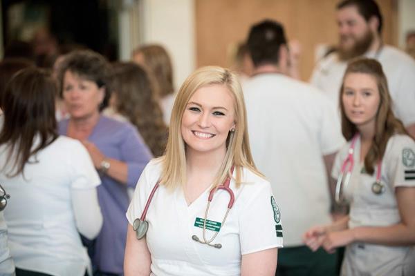 Maria Adams, a Husson University School of Nursing 2017 graduate, was just one of many students who has participated in pinning ceremonies in years past. During pinning ceremonies, undergraduate and graduate nursing students are symbolically welcomed into the nursing profession. They are presented with Husson University/Eastern Maine Medical Center BSN or Husson University MSN nursing pins by a family member. 