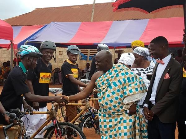 Mr. Solomon Owusu-Amankwaah (far right), development officer, Ghana Bamboo Bikes Initiative, stands with Nana Barima Dei Kusi Gyabaah (center), chairperson of Dormaa Traditional area, as he shakes hands with recipients of the recently distributed EcoRide Bamboo bikes, provided by the African Bicycle Contribution Foundation (ABCF), a U.S.-based, 501(c)3 non-profit corporation, in Philadelphia, PA. To date, ABCF has distributed 140 bicycles to transport-dependent students, farmers, healthcare workers and business owners, in Ghana.
 
