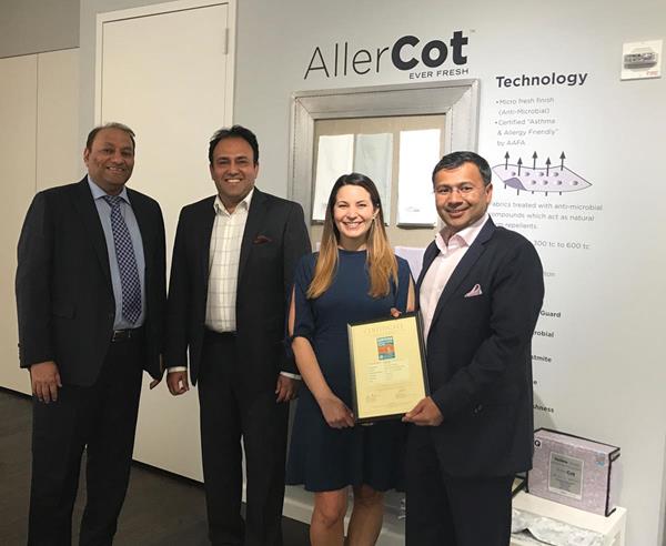 Courtney Sunna, VP Sales at asthma & allergy friendly®, presenting the official certificate to KK Lalpuria, Executive Director, Gautam Sareen, VP Marketing, and Mohit Jain, Managing Director at Indo Count. 

