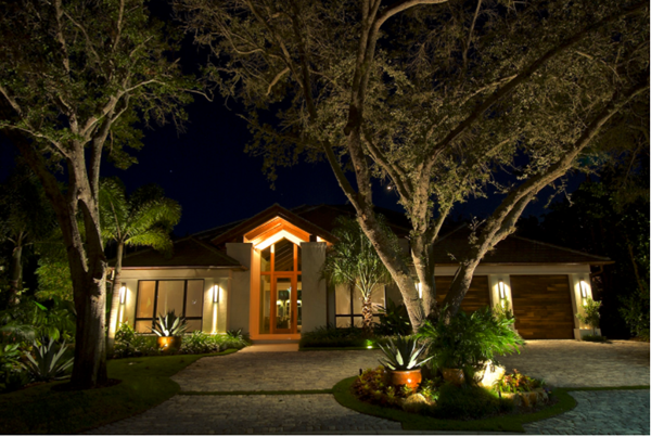 This Pelican Bay home's lush, tropical landscape and stunning cobblestone driveway were an inspiration to expert outdoor lighting designer, John Gillespie. Using strategically placed up-lighting, Mr. Gillespie and the Outdoor Lighting Perspectives of Naples team highlighted the grandeur of two large oak trees on each side of the driveway. 