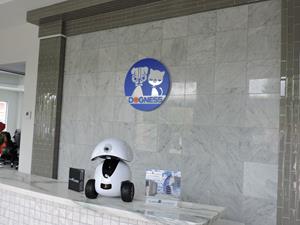 The Dogness Smart iPet Robot on display at the new office’s reception desk.